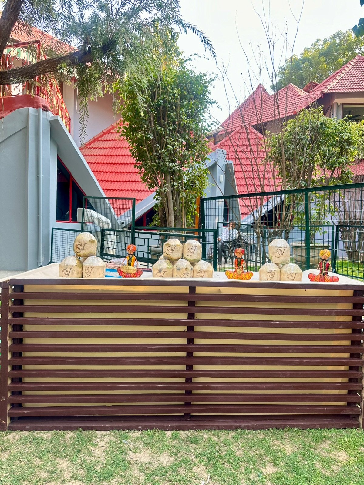 Outdoor wedding coconut stall setup with customized coconuts